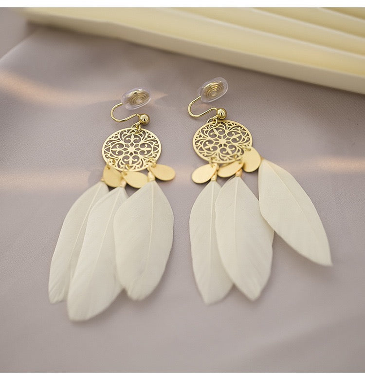 Clip on earrings - bohemian style white feather and golden geometric shape