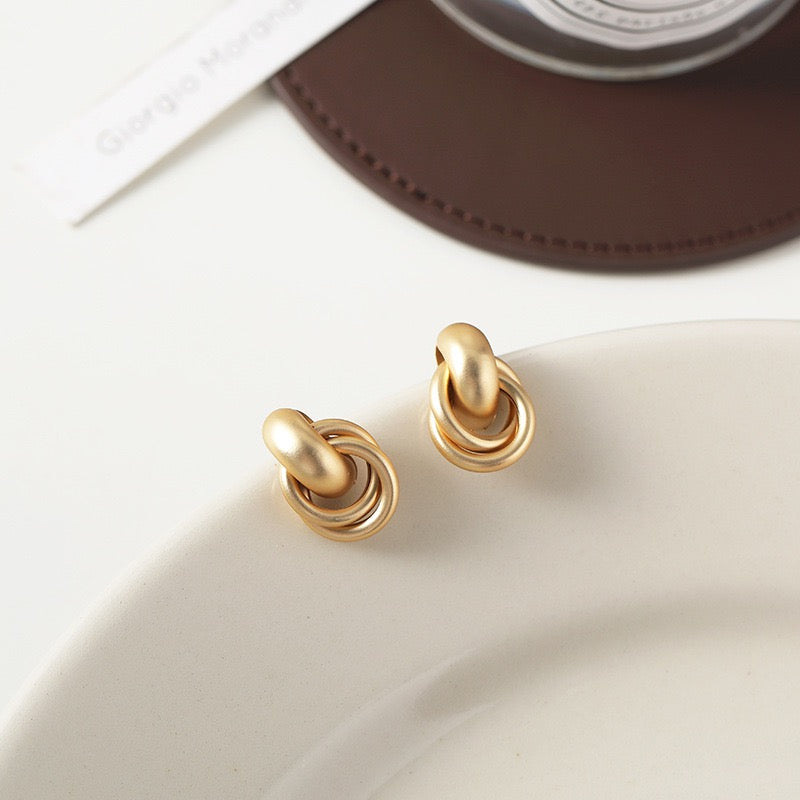 Clip on earrings - matte golden cross rings