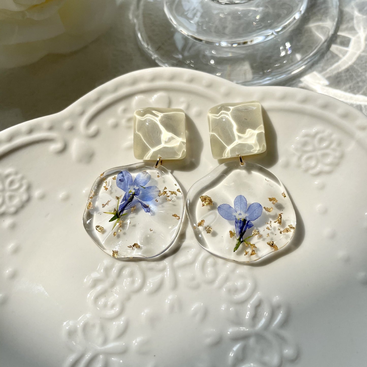 Clip on earrings - unique blue dried flower and gold flakes