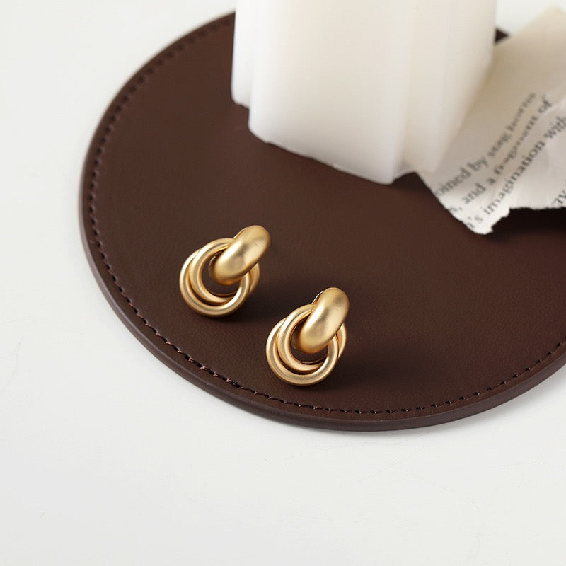 Clip on earrings - matte golden cross rings